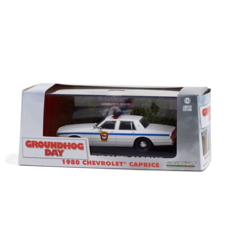 Miniatura coche policía Chevrolet Caprice 1980 Punxsutawney Police de la película El día de la marmota a escala 1/43 con caja de cartón expositora Greenlight