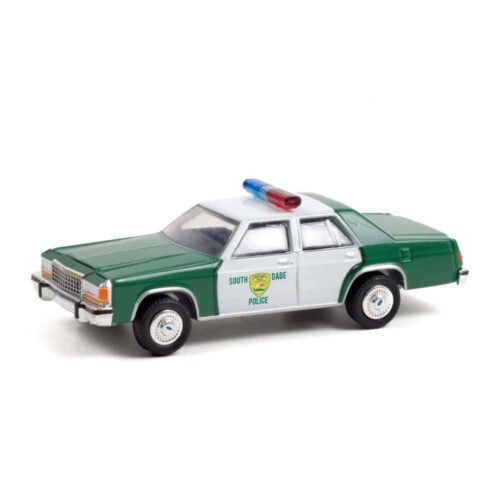 Miniatura coche policía blanco y verde Ford LTD Crown Victoria 1983 Miami Police de la película Ace Ventura: Detective de mascotas a escala 1/64 Greenlight