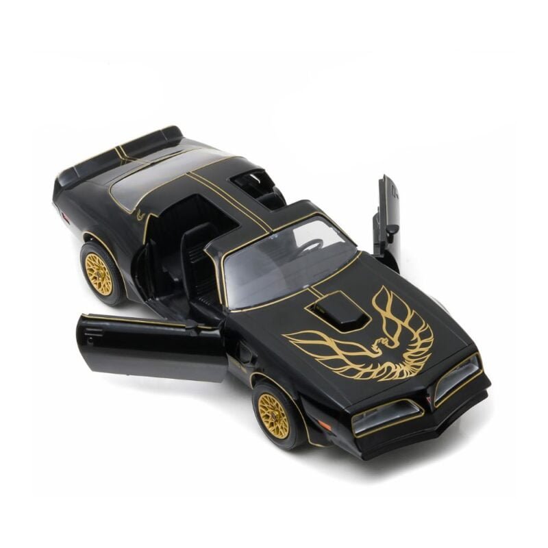 Miniatura coche Pontiac Trans Am 1977 negro con gráficos dorados de la película Smokey and the Bandit a escala 1/24 Greenlight